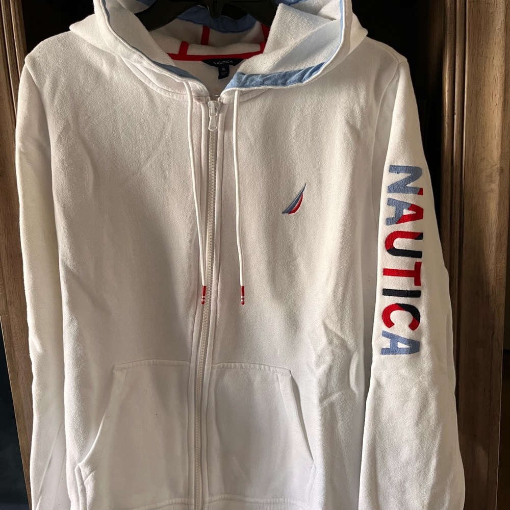 White sweater with blue and red